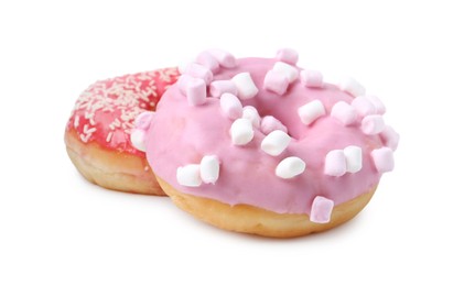 Photo of Delicious donuts with marshmallows and sprinkles isolated on white