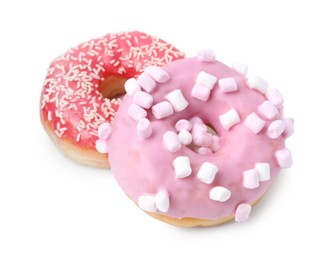 Photo of Delicious donuts with marshmallows and sprinkles isolated on white