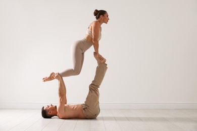 Photo of Couple of professional dancers training in studio. Space for text