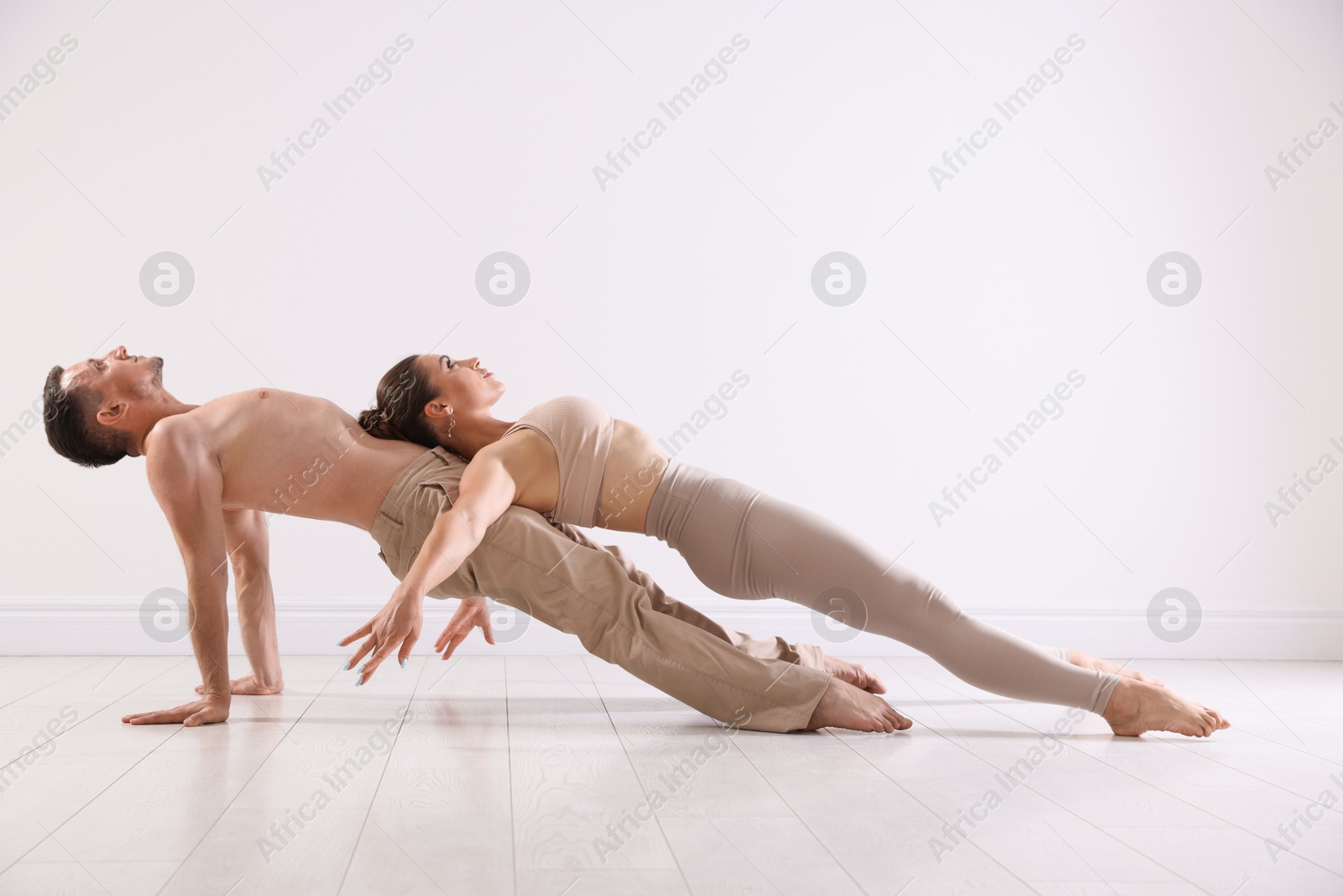Couple of professional dancers training in studio. Space for text Photo of Couple of professional dancers training in studio. Space for text