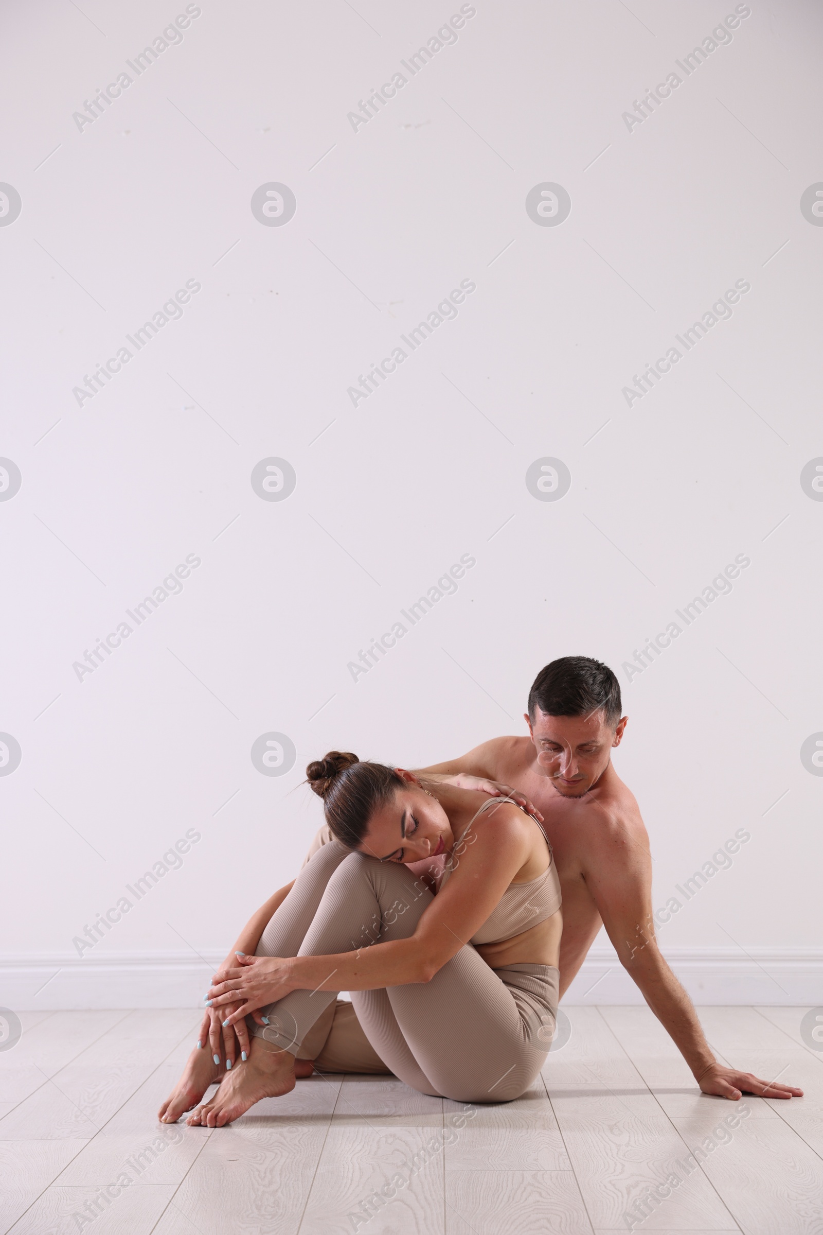 Photo of Couple of professional dancers training in studio. Space for text
