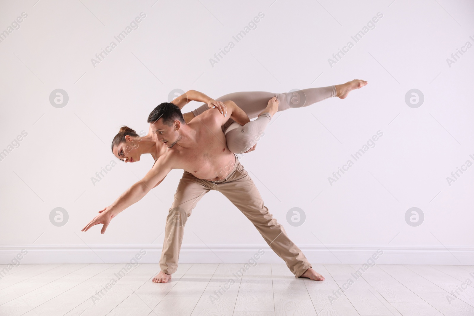 Photo of Couple of professional dancers training in studio