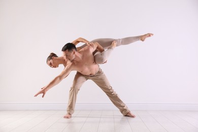 Photo of Couple of professional dancers training in studio