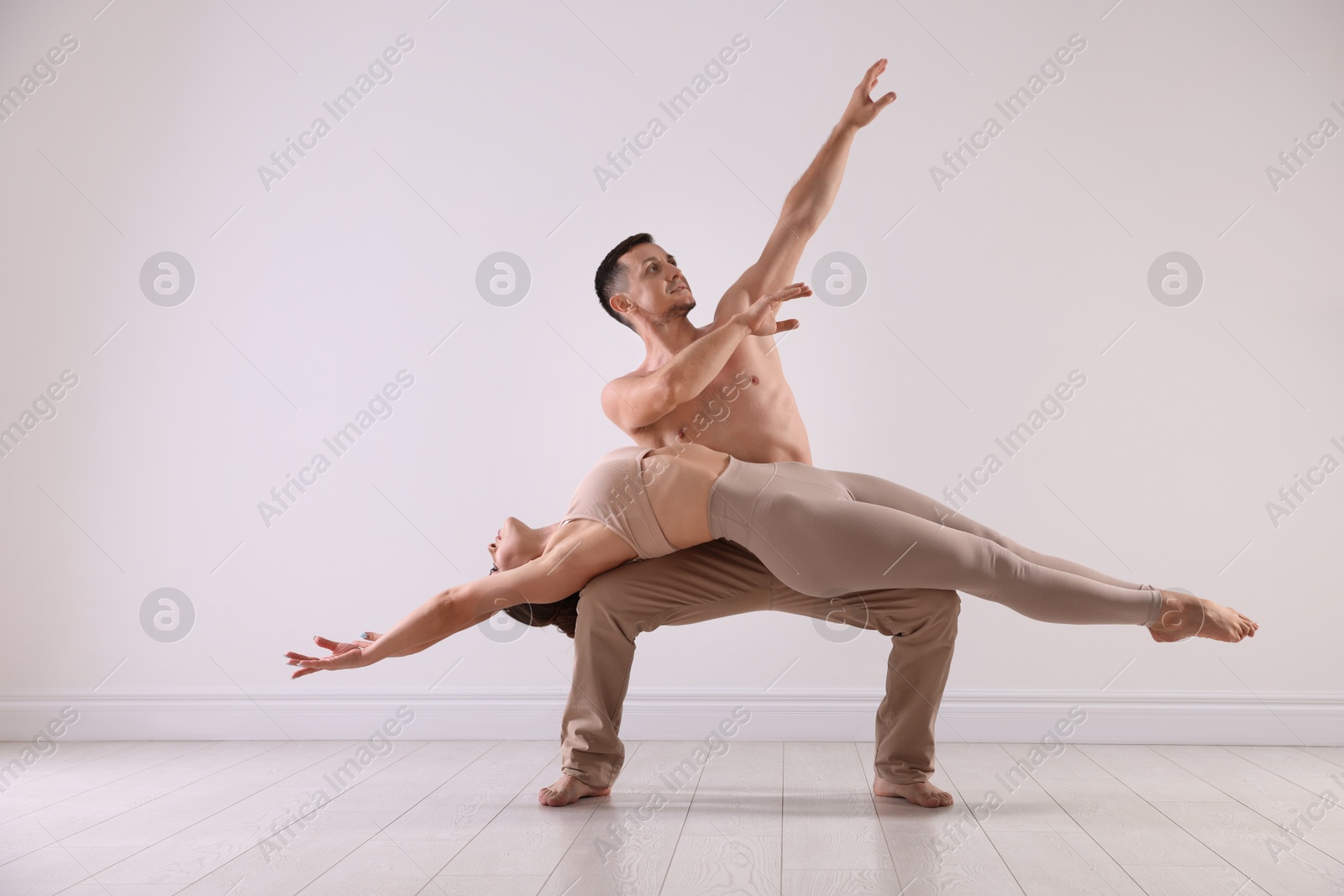 Photo of Couple of professional dancers training in studio