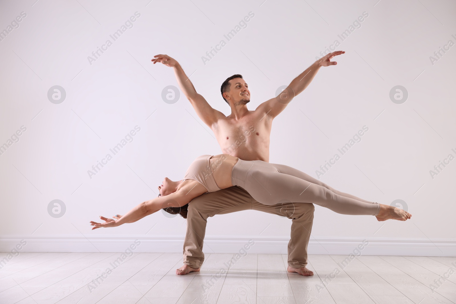 Couple of professional dancers training in studio Photo of Couple of professional dancers training in studio
