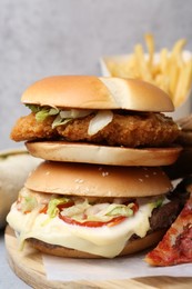 Photo of Different delicious fast food on table, closeup