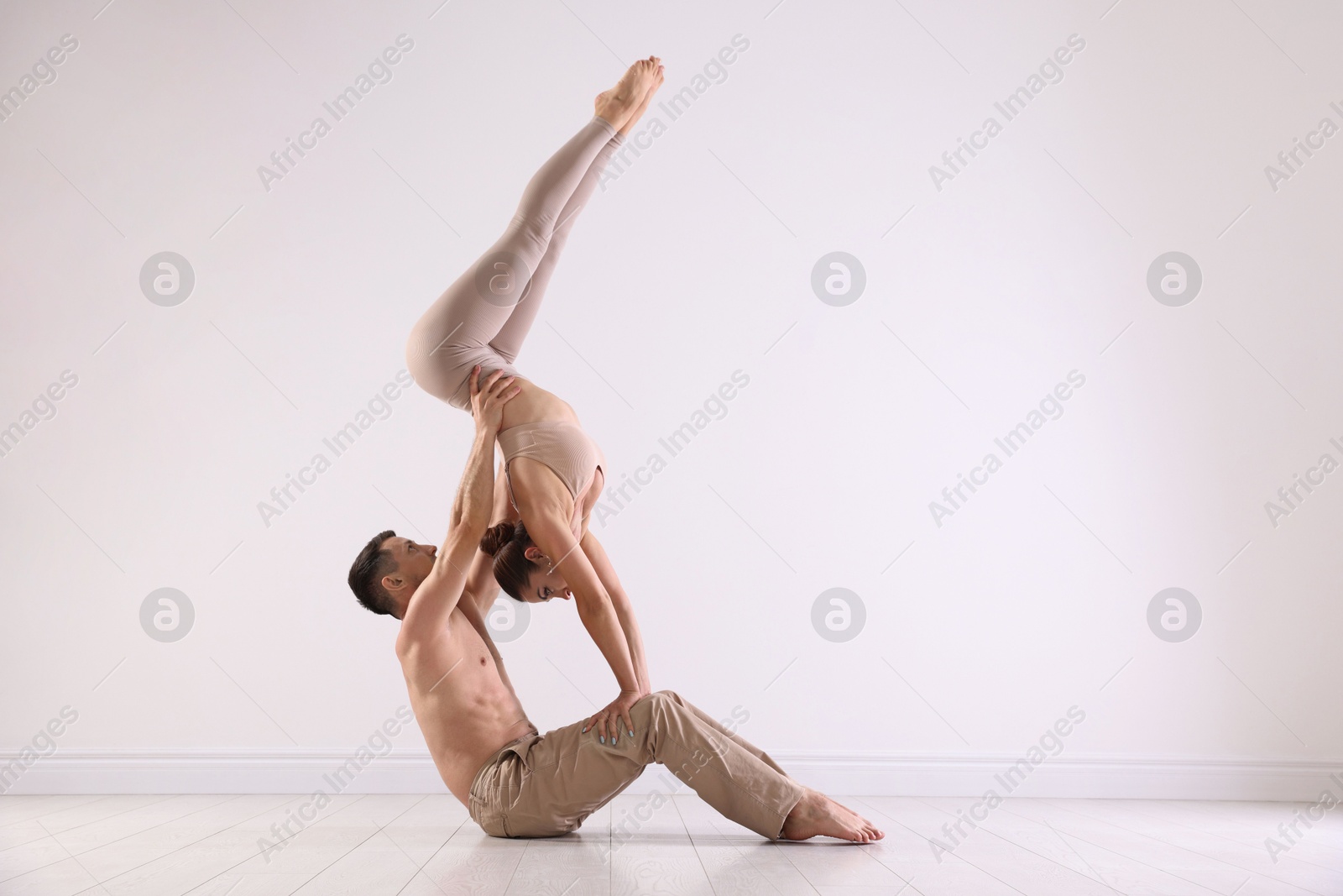 Photo of Couple of professional dancers training in studio. Space for text