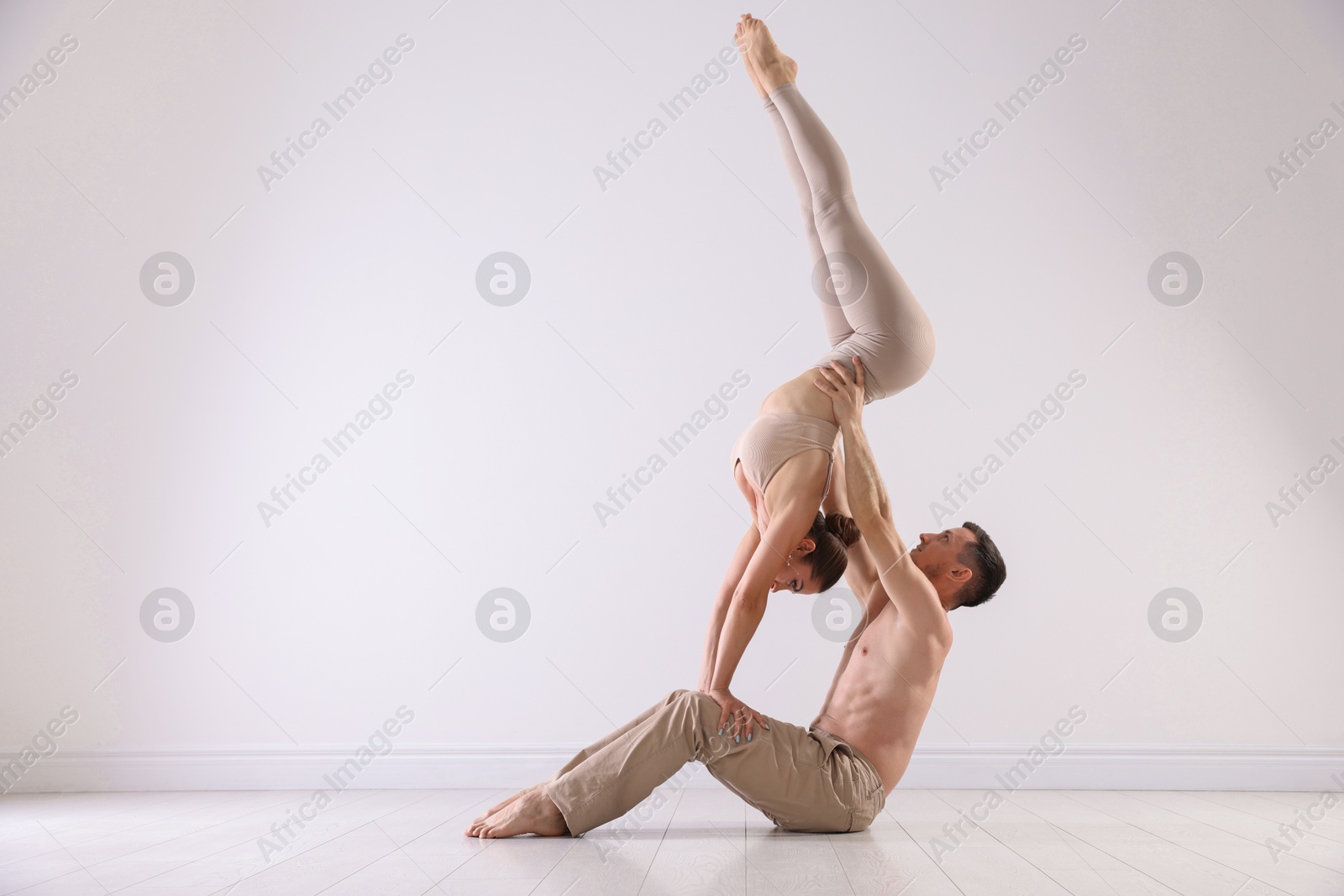 Photo of Couple of professional dancers training in studio. Space for text