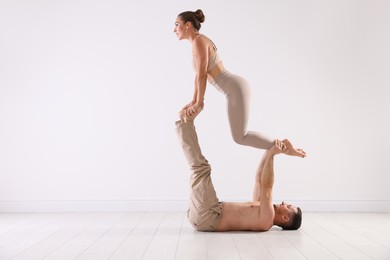 Photo of Couple of professional dancers training in studio. Space for text