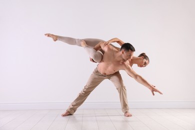 Photo of Couple of professional dancers training in studio