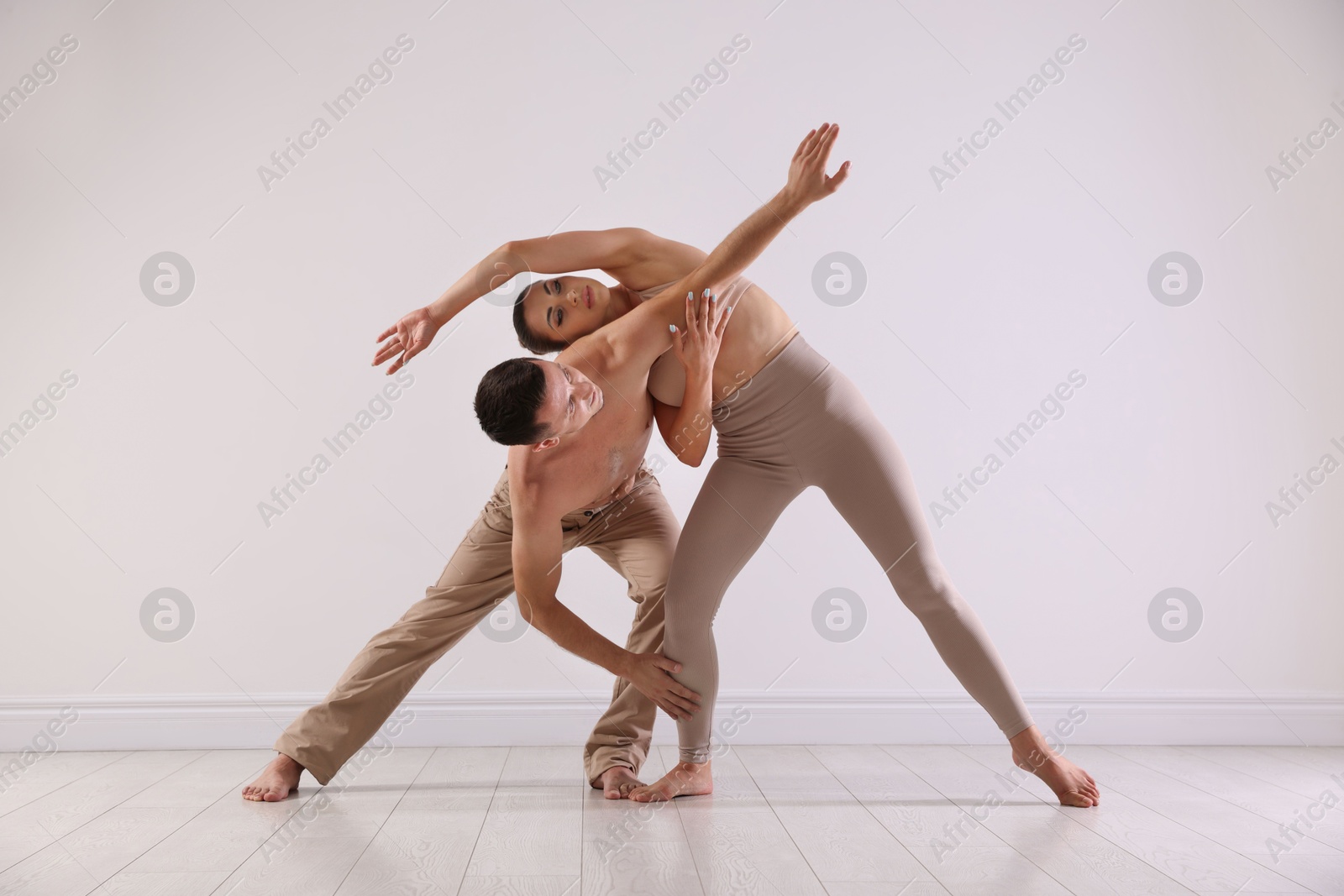 Photo of Couple of professional dancers training in studio