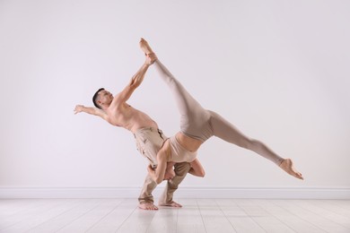 Photo of Couple of professional dancers training in studio