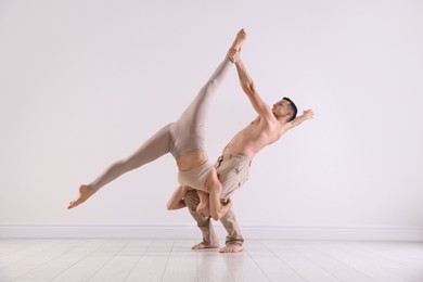 Photo of Couple of professional dancers training in studio