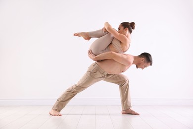 Photo of Couple of professional dancers training in studio