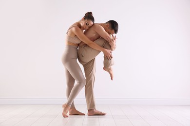 Photo of Couple of professional dancers training in studio