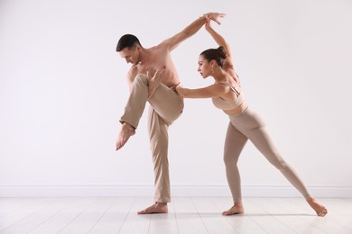 Photo of Couple of professional dancers training in studio