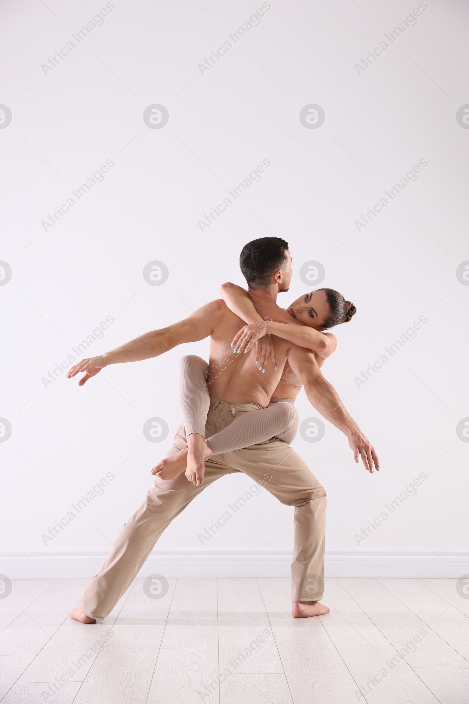 Photo of Couple of professional dancers training in studio