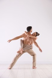 Photo of Couple of professional dancers training in studio
