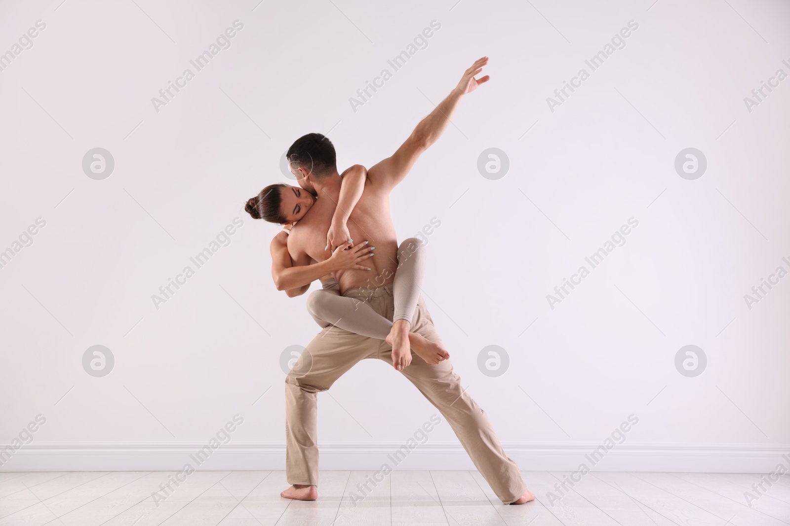 Photo of Couple of professional dancers training in studio