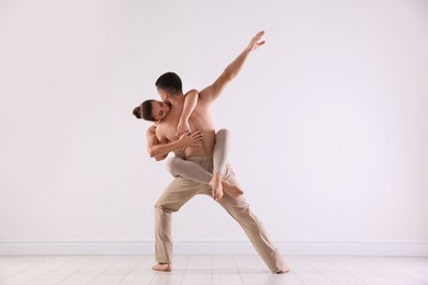 Photo of Couple of professional dancers training in studio