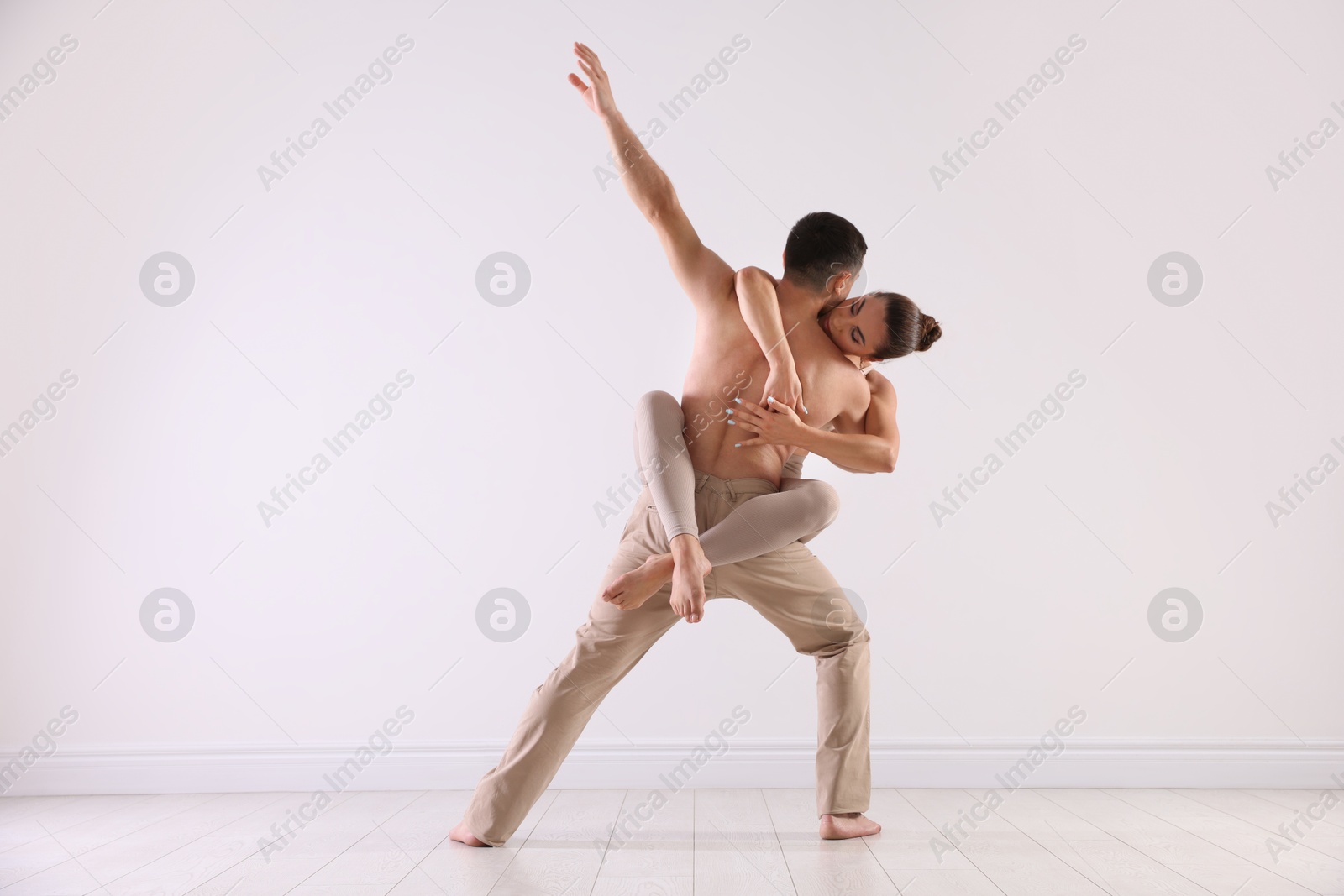 Couple of professional dancers training in studio Photo of Couple of professional dancers training in studio