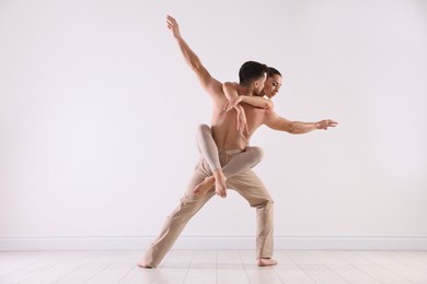 Photo of Couple of professional dancers training in studio