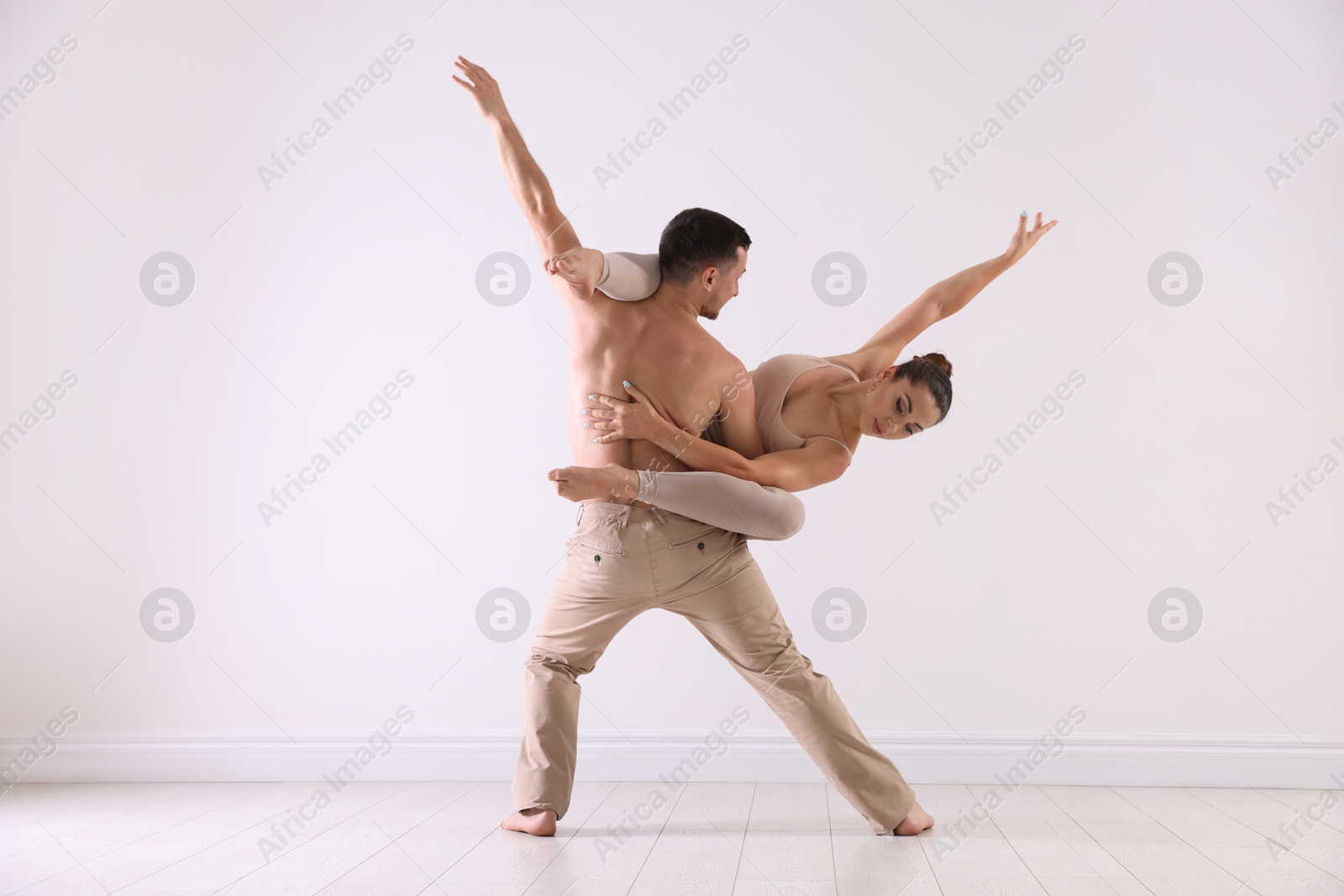 Photo of Couple of professional dancers training in studio
