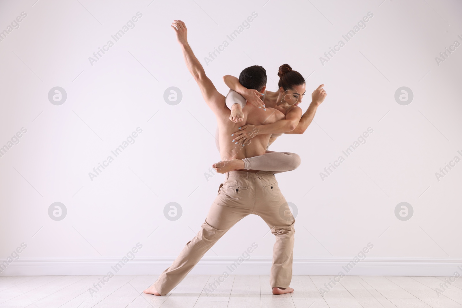 Photo of Couple of professional dancers training in studio