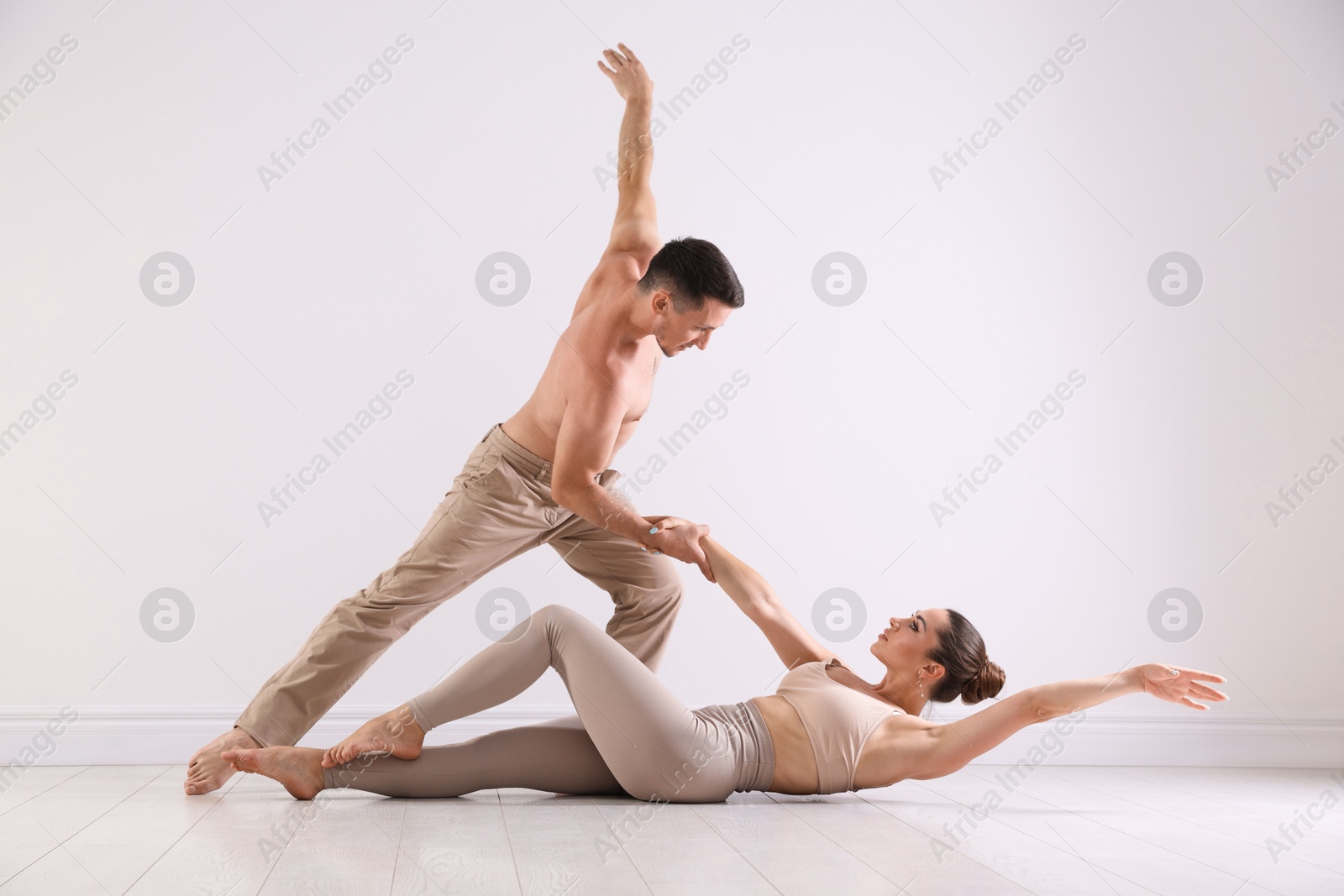 Couple of professional dancers training in studio Photo of Couple of professional dancers training in studio
