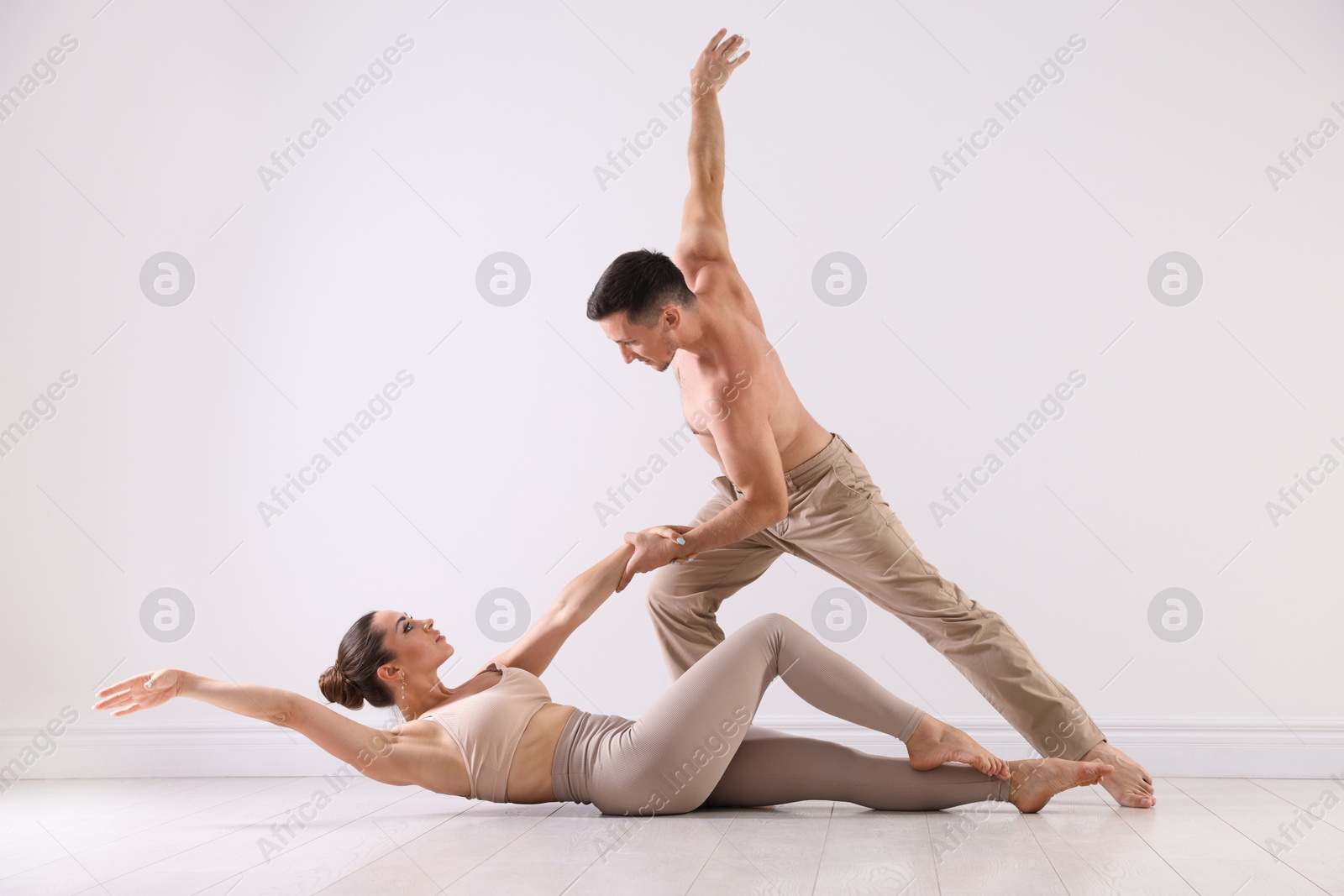Couple of professional dancers training in studio Photo of Couple of professional dancers training in studio