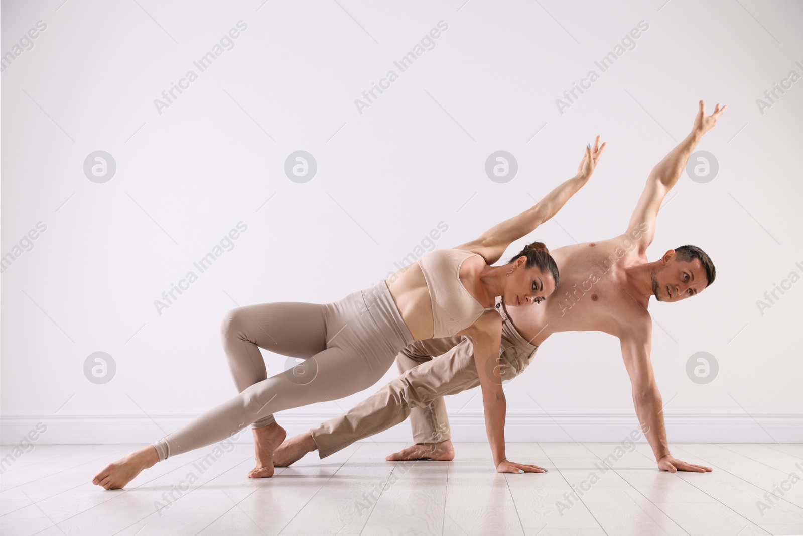 Couple of professional dancers training in studio Photo of Couple of professional dancers training in studio