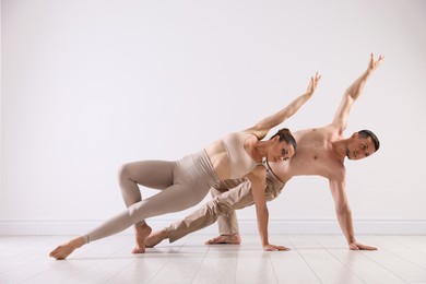 Photo of Couple of professional dancers training in studio