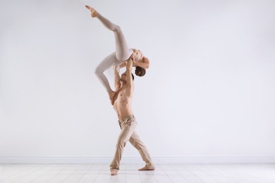 Photo of Couple of professional dancers training in studio