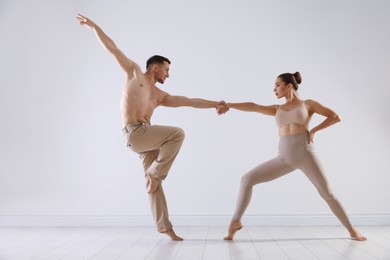 Photo of Couple of professional dancers training in studio