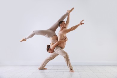 Photo of Couple of professional dancers training in studio