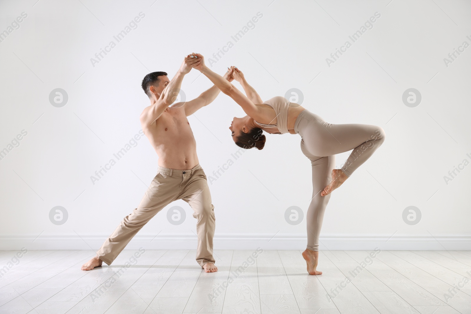Couple of professional dancers training in studio Photo of Couple of professional dancers training in studio