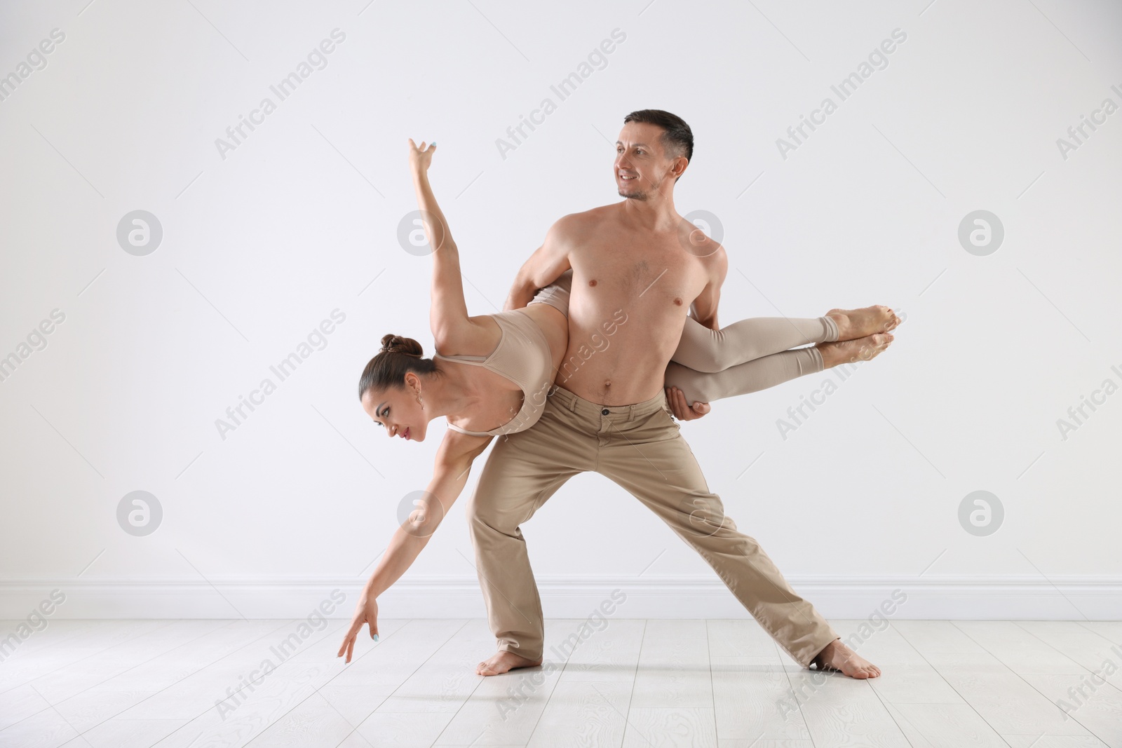 Couple of professional dancers training in studio Photo of Couple of professional dancers training in studio