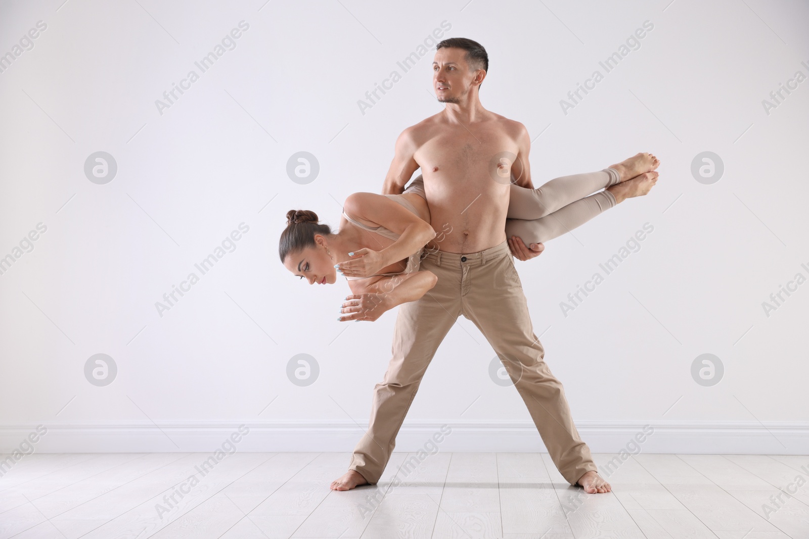 Couple of professional dancers training in studio Photo of Couple of professional dancers training in studio