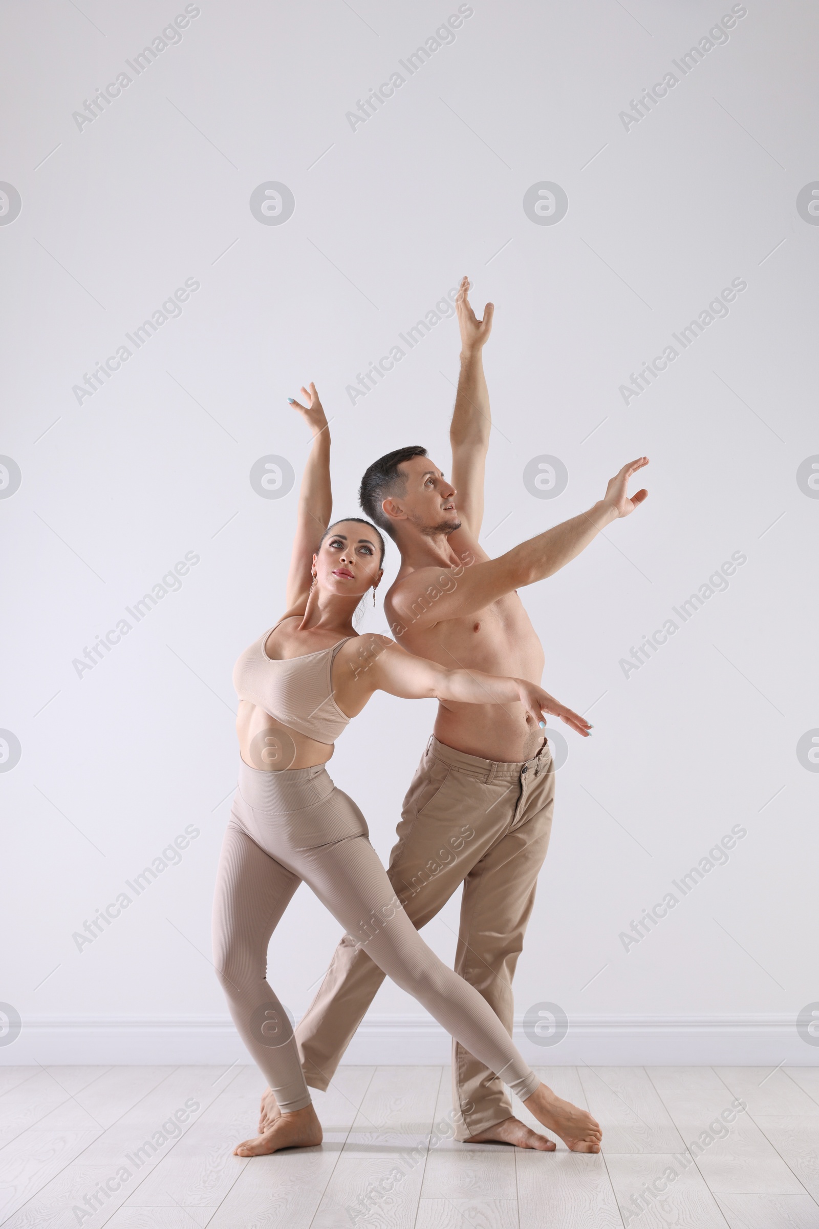 Couple of professional dancers training in studio Photo of Couple of professional dancers training in studio