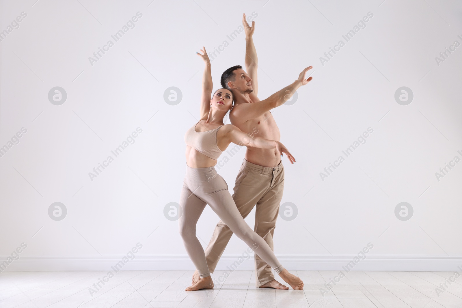 Couple of professional dancers training in studio Photo of Couple of professional dancers training in studio