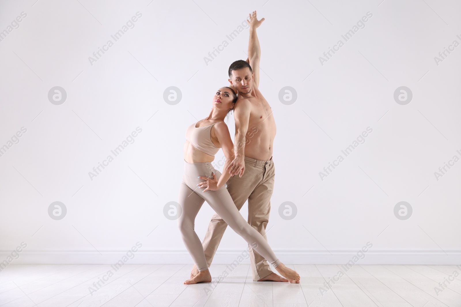 Couple of professional dancers training in studio Photo of Couple of professional dancers training in studio