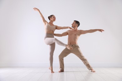 Photo of Couple of professional dancers training in studio