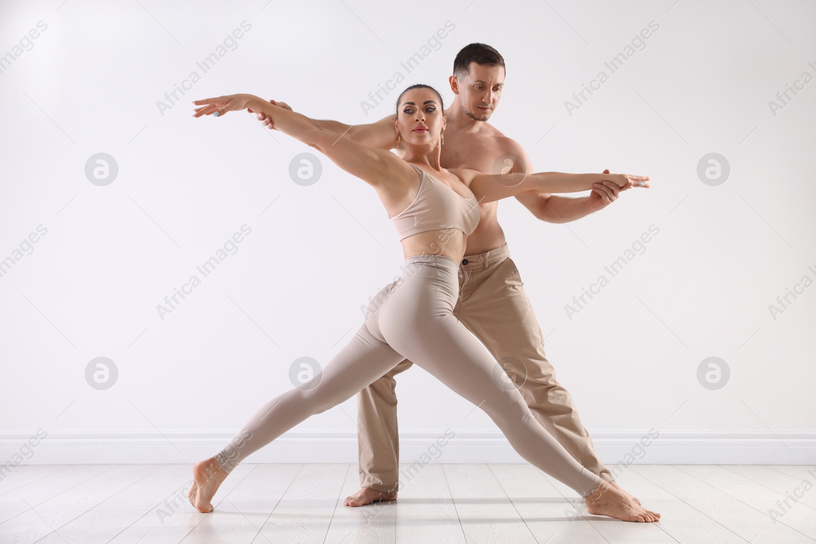 Couple of professional dancers training in studio Photo of Couple of professional dancers training in studio
