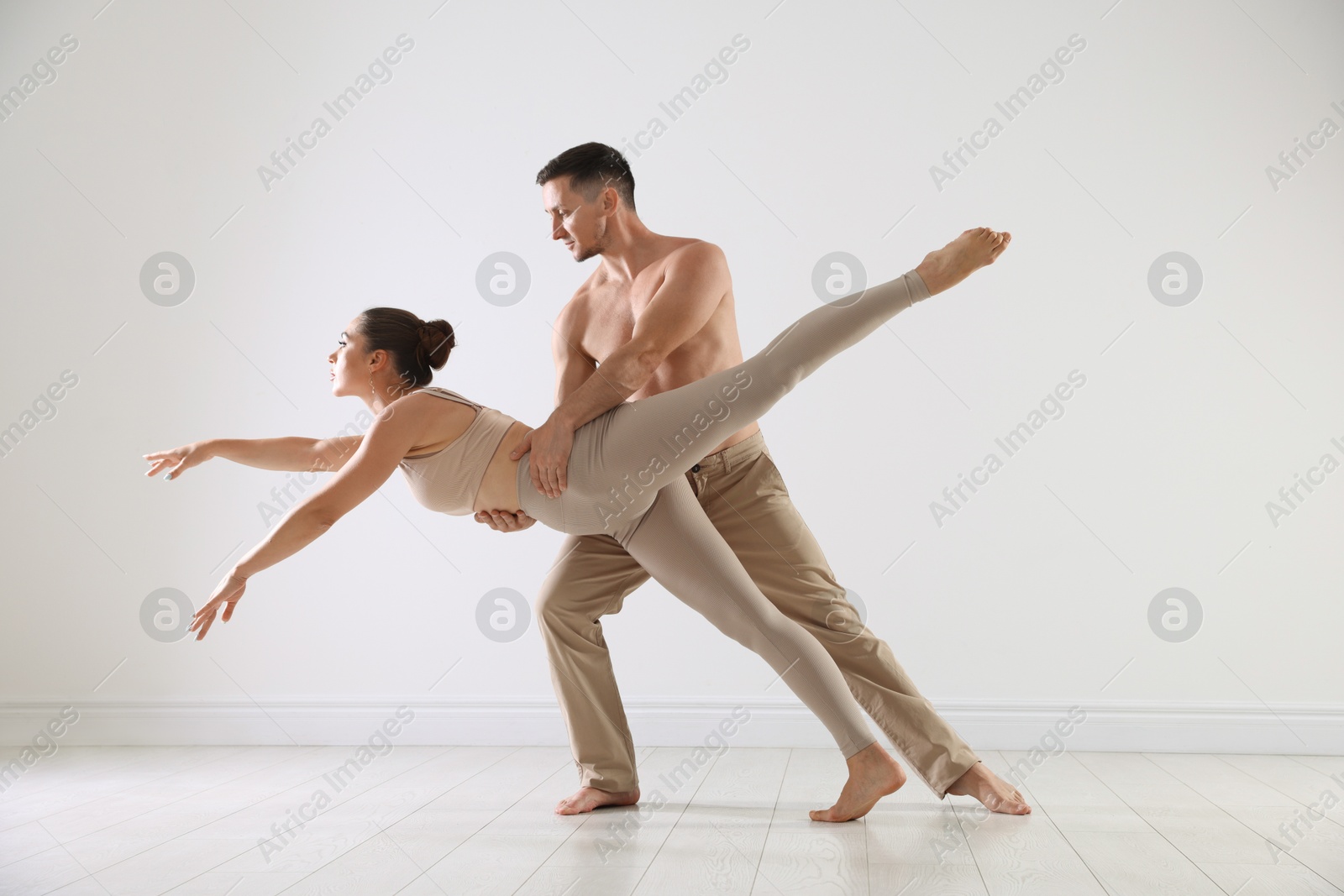 Couple of professional dancers training in studio Photo of Couple of professional dancers training in studio