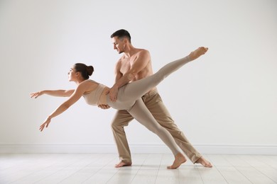 Photo of Couple of professional dancers training in studio