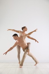 Photo of Couple of professional dancers training in studio