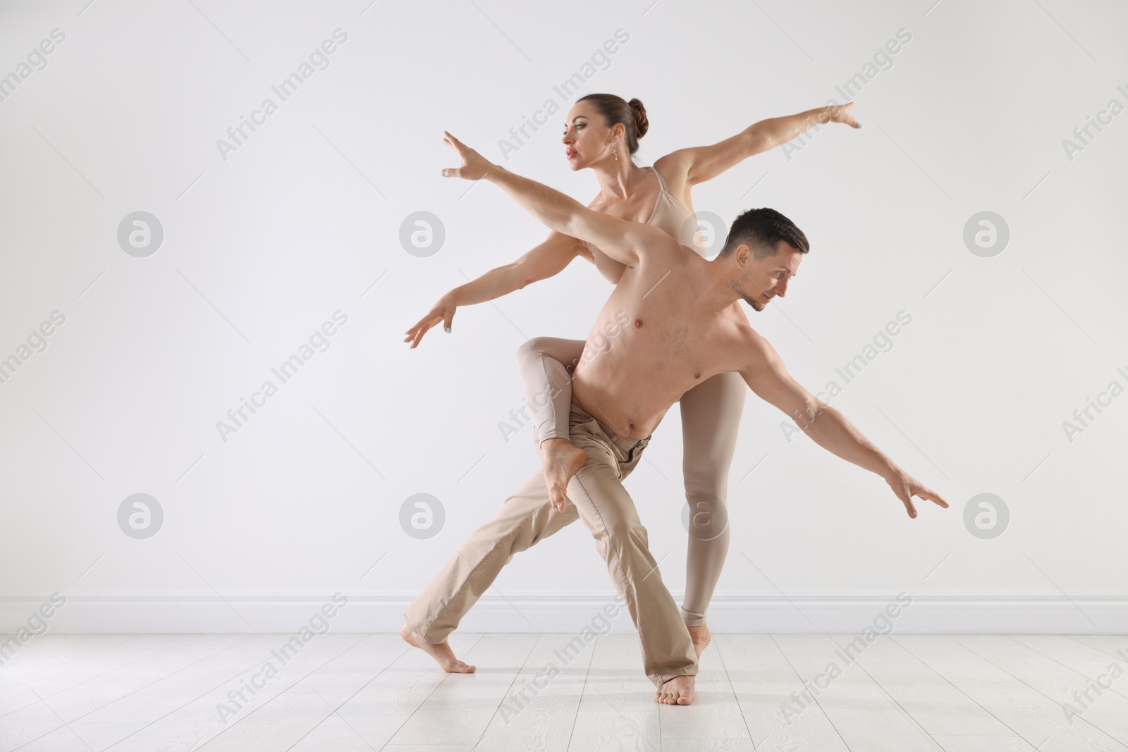 Couple of professional dancers training in studio Photo of Couple of professional dancers training in studio