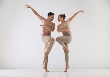 Photo of Couple of professional dancers training in studio