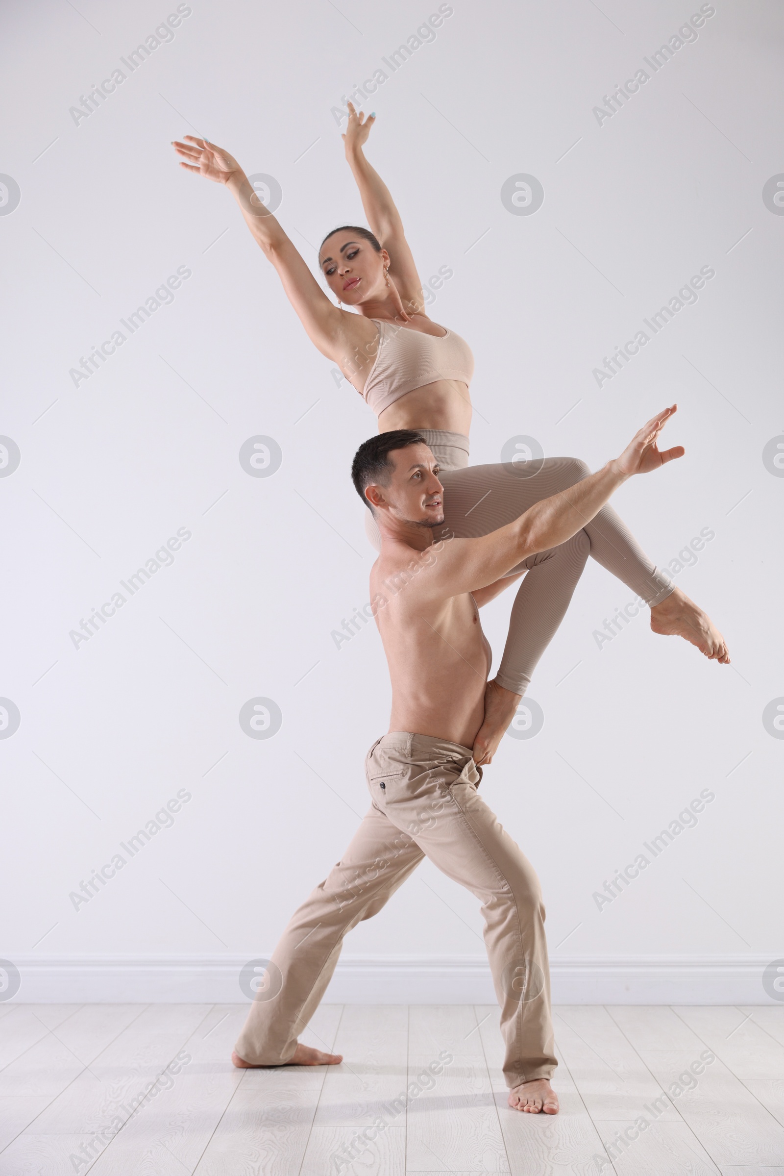 Couple of professional dancers training in studio Photo of Couple of professional dancers training in studio