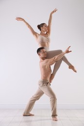Photo of Couple of professional dancers training in studio